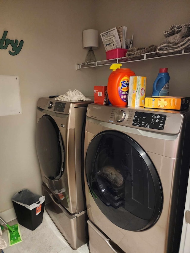 washroom featuring separate washer and dryer and tile patterned floors