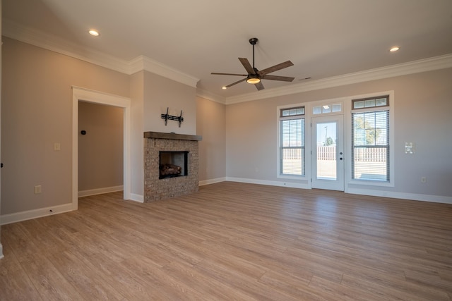 unfurnished living room featuring ceiling fan, ornamental molding, and light hardwood / wood-style floors