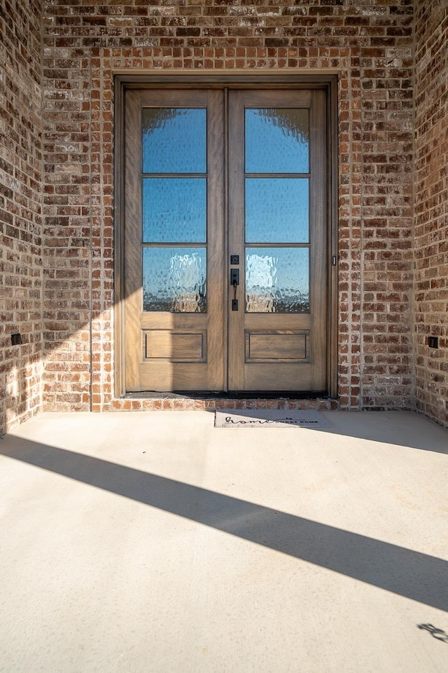 entrance to property featuring french doors