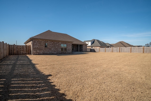 back of house with a patio