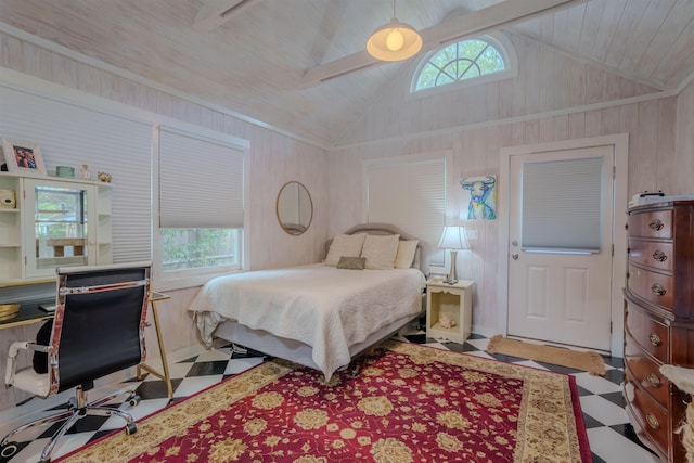  - bedroom with multiple windows, vaulted ceiling, wood walls, and an office area