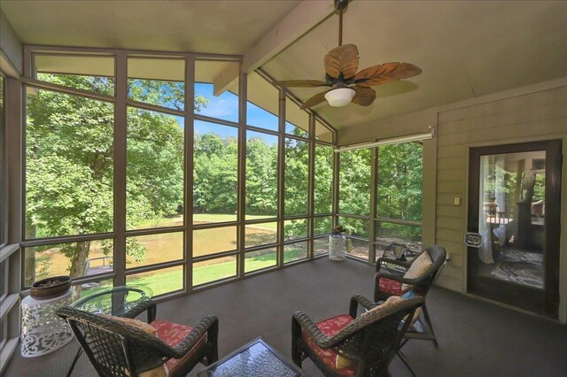  - sunroom with a ceiling fan and vaulted ceiling