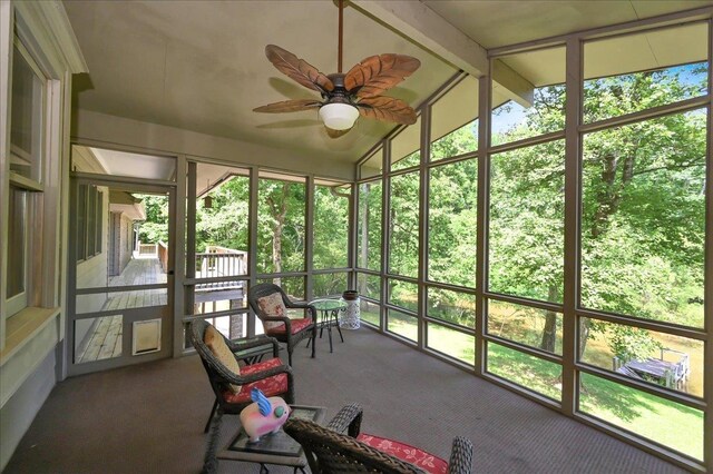  - sunroom / solarium with ceiling fan and lofted ceiling