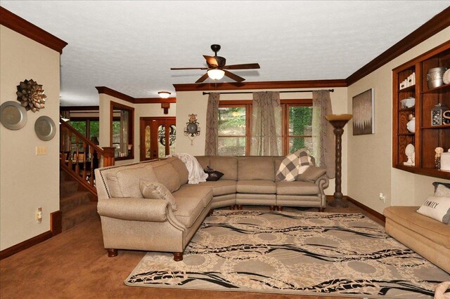  - living room with baseboards, ornamental molding, a ceiling fan, stairs, and a textured ceiling