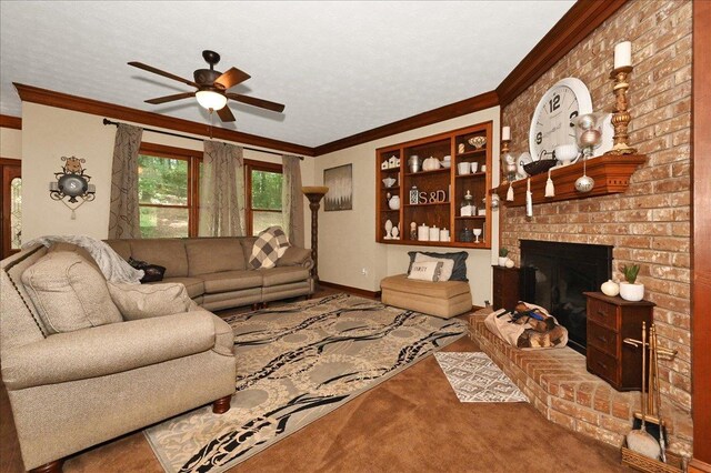  - living area featuring ceiling fan, crown molding, a fireplace, carpet, and baseboards