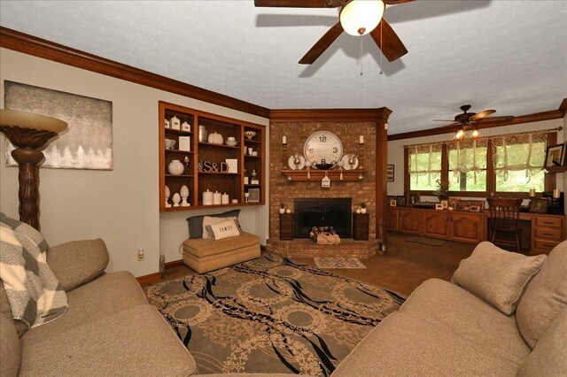  - living area with ceiling fan, crown molding, and a fireplace