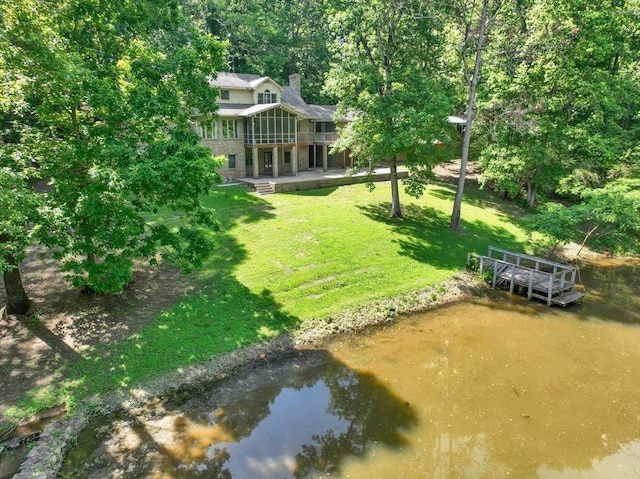 - view of green lawn featuring a water view and a balcony