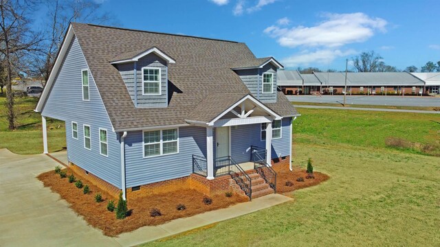 back of house with a carport and a yard