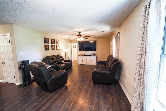  - living room with dark wood finished floors, a ceiling fan, a textured ceiling, healthy amount of natural light, and baseboards