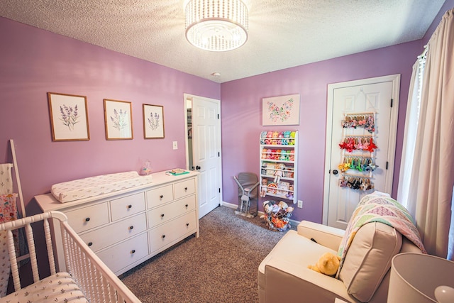  - bedroom with dark carpet, a chandelier, a textured ceiling, and baseboards