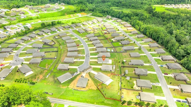  - aerial perspective of suburban area featuring a heavily wooded area