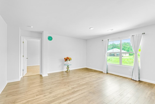  - unfurnished room featuring light wood-style flooring and baseboards