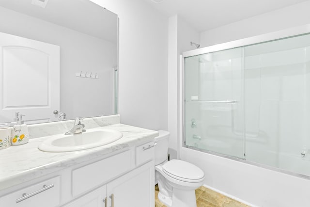  - full bathroom featuring vanity, toilet, and shower / bath combination with glass door