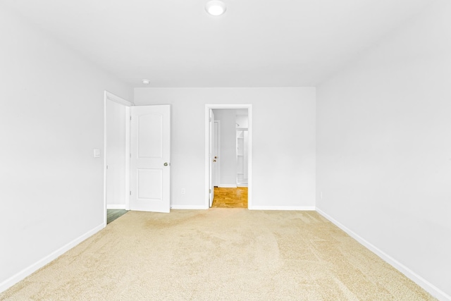  - carpeted empty room with baseboards