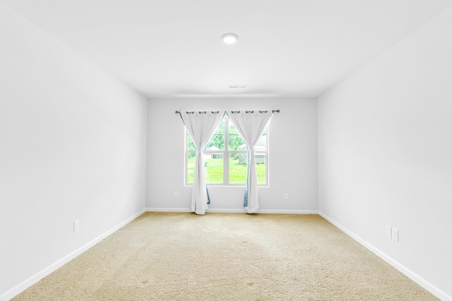 - spare room with carpet flooring and baseboards