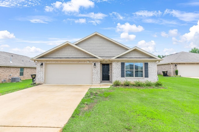  - view of front of house with central air condition unit, an attached garage, a front yard, concrete driveway, and brick siding