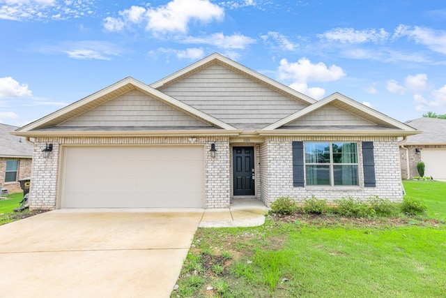  - view of front of property featuring concrete driveway, a front yard, an attached garage, and brick siding