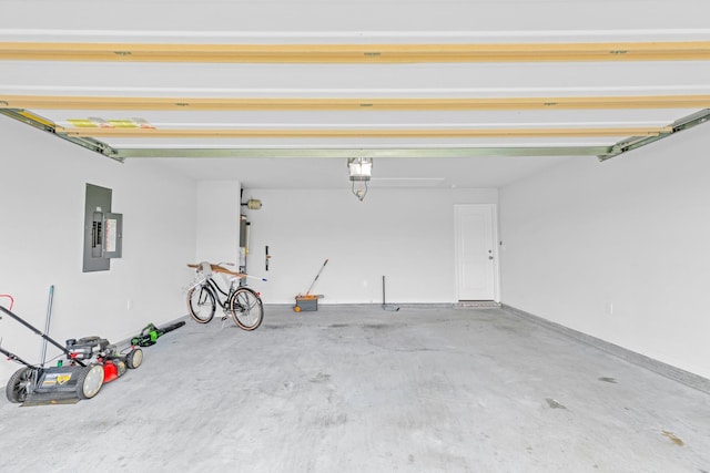  - garage featuring electric panel and a garage door opener