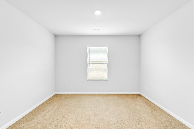  - carpeted empty room featuring baseboards