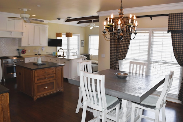  - dining space featuring ceiling fan, dark wood-type flooring, a chandelier, and ornamental molding