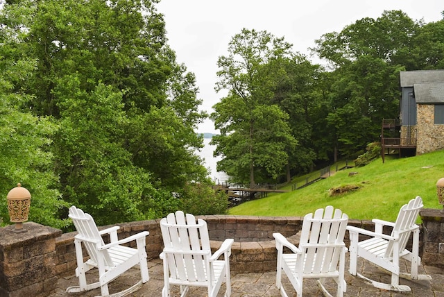  - view of patio featuring a fire pit