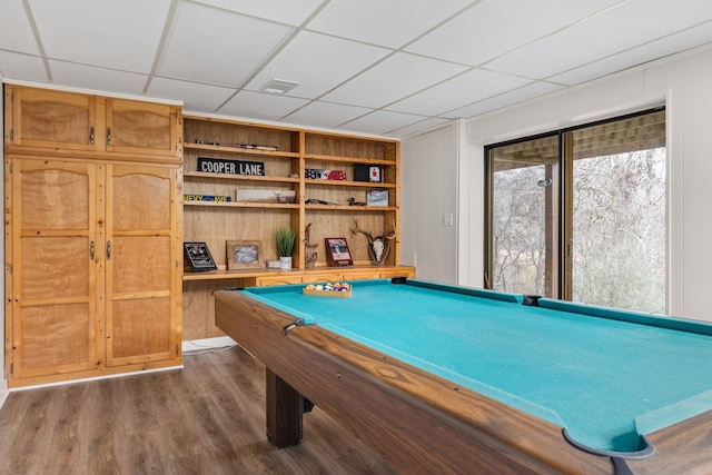 recreation room with a drop ceiling, dark wood-type flooring, built in features, and billiards