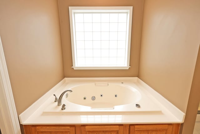 bathroom featuring a washtub