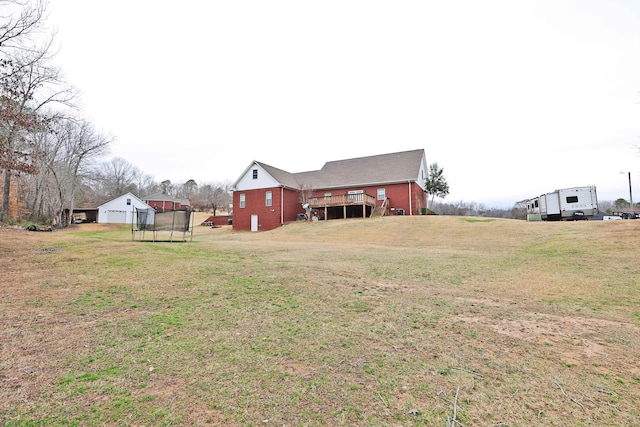 view of yard featuring a wooden deck