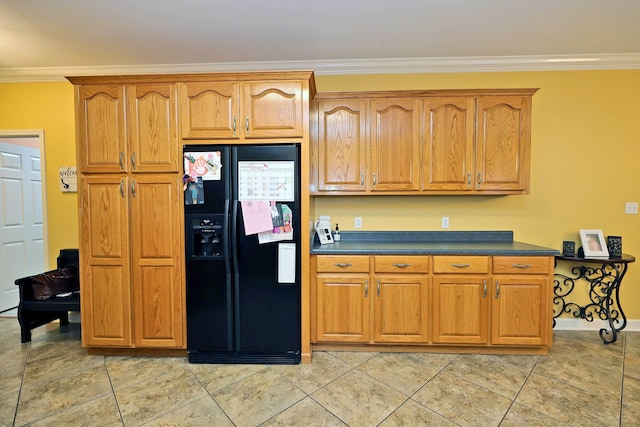 kitchen with light tile patterned floors, crown molding, and black fridge with ice dispenser