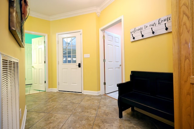 doorway to outside with crown molding and light tile patterned floors