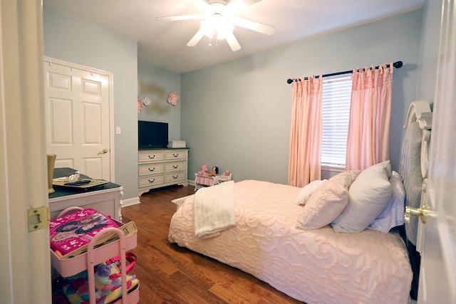 bedroom with ceiling fan and dark hardwood / wood-style flooring