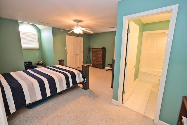 bedroom with light carpet, a closet, and ceiling fan