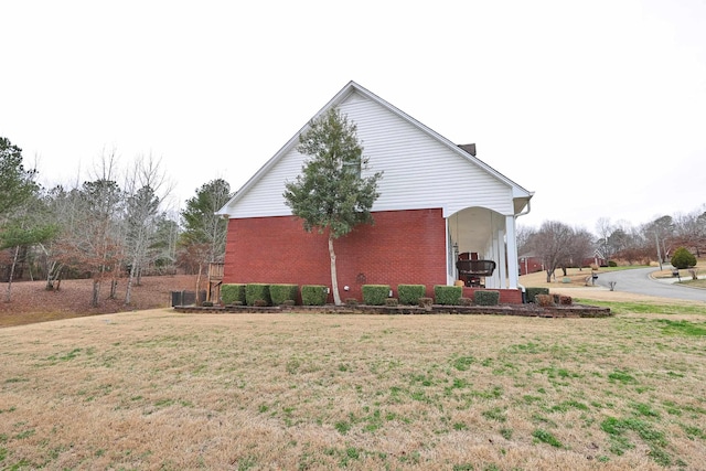 view of home's exterior featuring a lawn