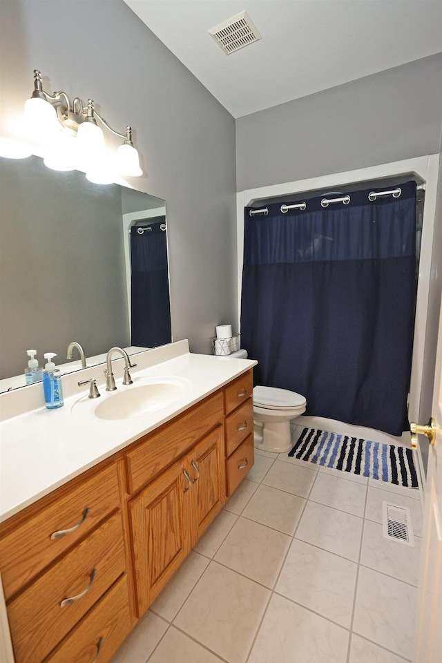 bathroom with a shower with shower curtain, tile patterned floors, toilet, and vanity