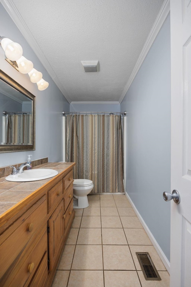 bathroom with a shower with curtain, tile patterned floors, a textured ceiling, vanity, and ornamental molding