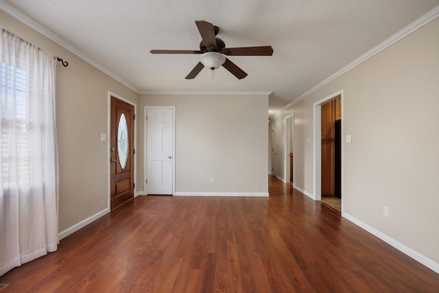 interior space with ceiling fan, crown molding, dark wood-type flooring, and a textured ceiling