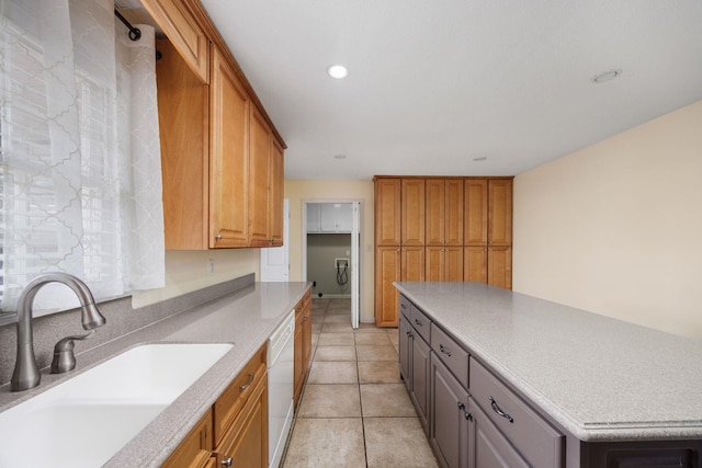 kitchen featuring a center island, sink, white dishwasher, gray cabinets, and light tile patterned floors