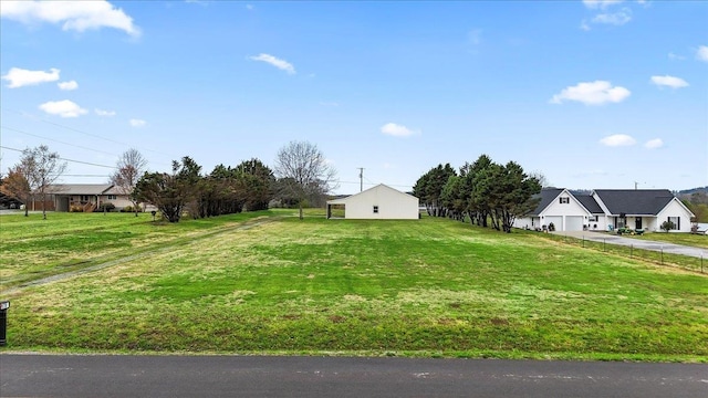 view of yard with driveway and an attached garage