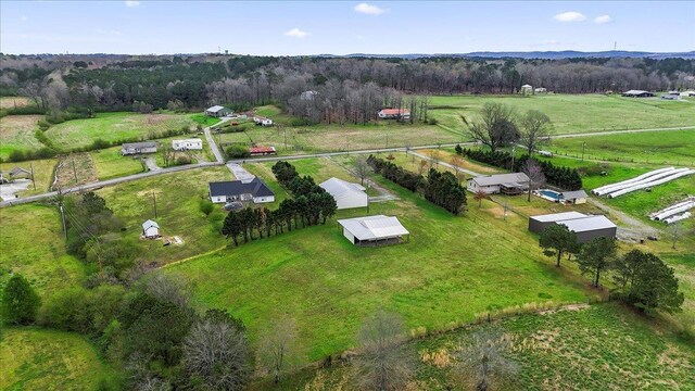 aerial view featuring a rural view and a view of trees
