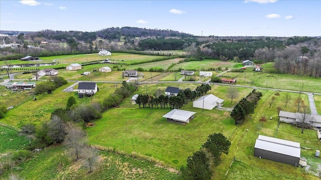 birds eye view of property with a rural view