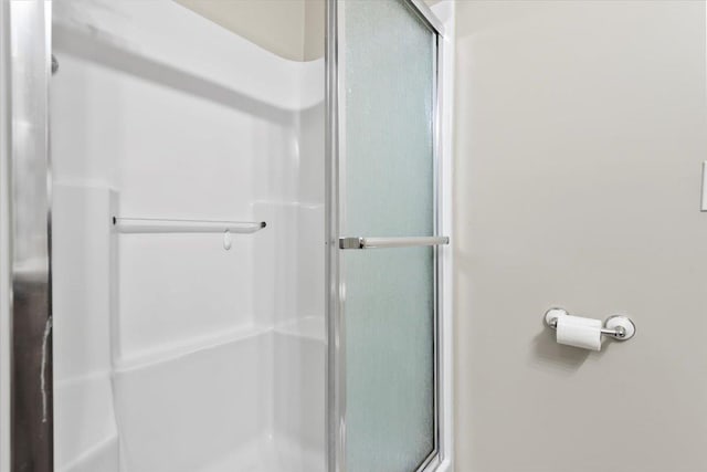 full bathroom with a shower stall