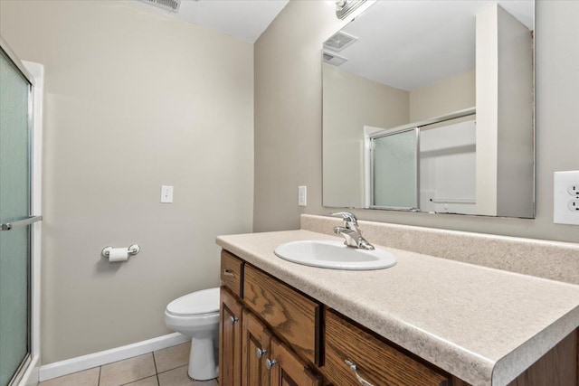 full bath with tile patterned flooring, vanity, toilet, baseboards, and a shower with shower door