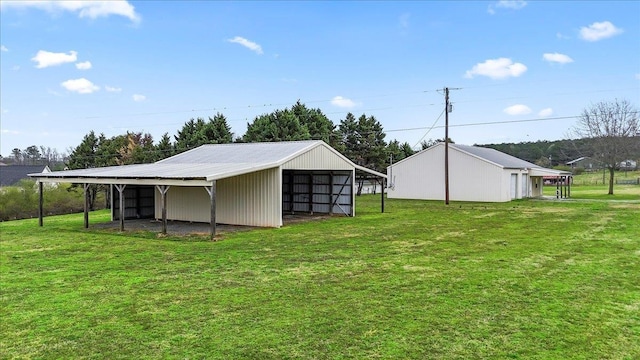 exterior space with an outdoor structure, a pole building, and a carport