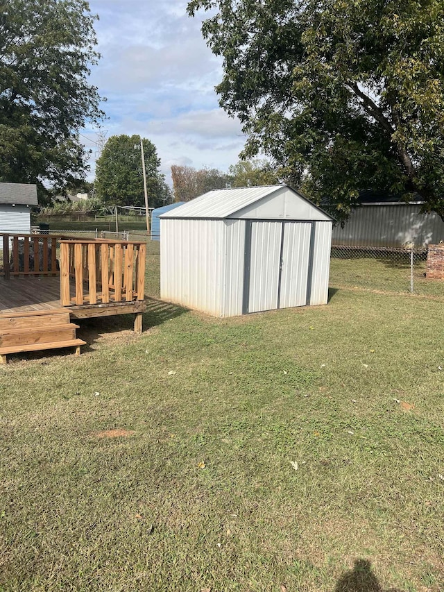  - view of outdoor structure with a lawn