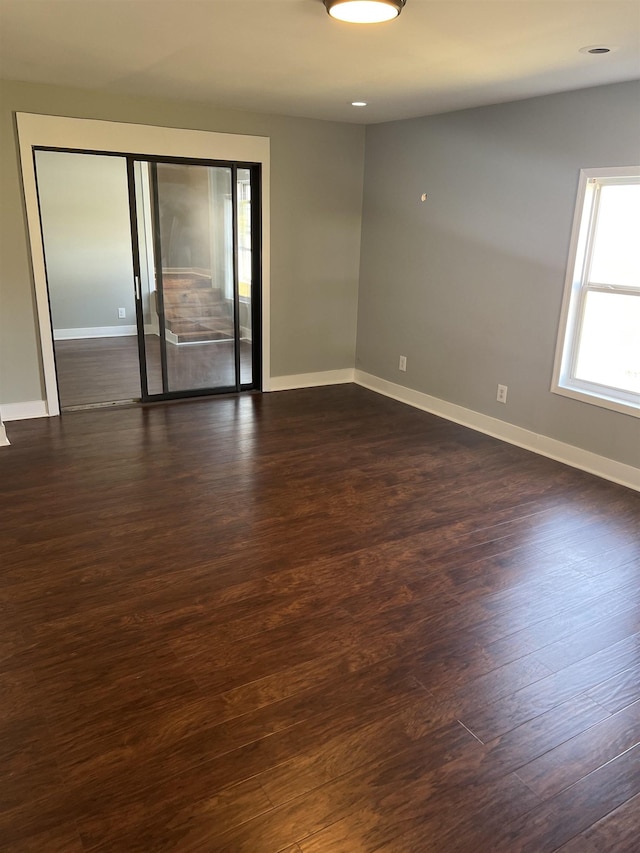  - empty room featuring dark hardwood / wood-style floors