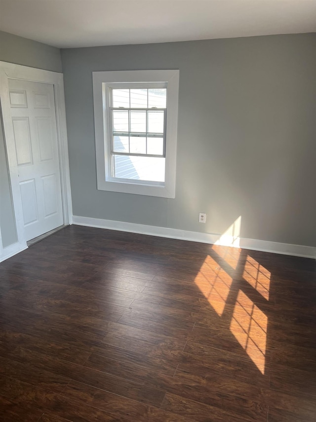  - spare room with dark hardwood / wood-style floors