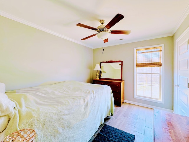 bedroom with light wood-type flooring, crown molding, baseboards, and ceiling fan