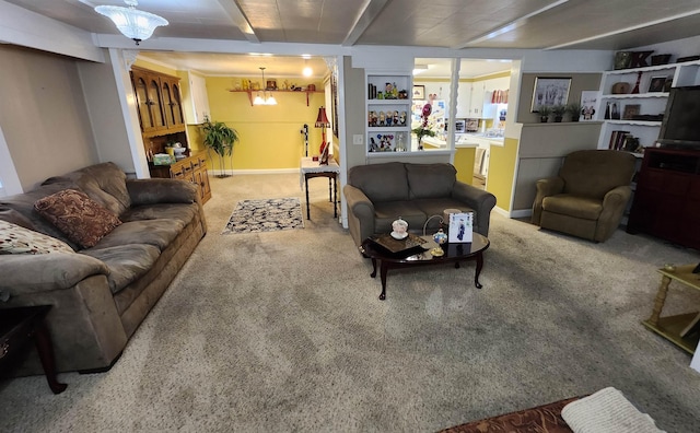  - carpeted living area with baseboards