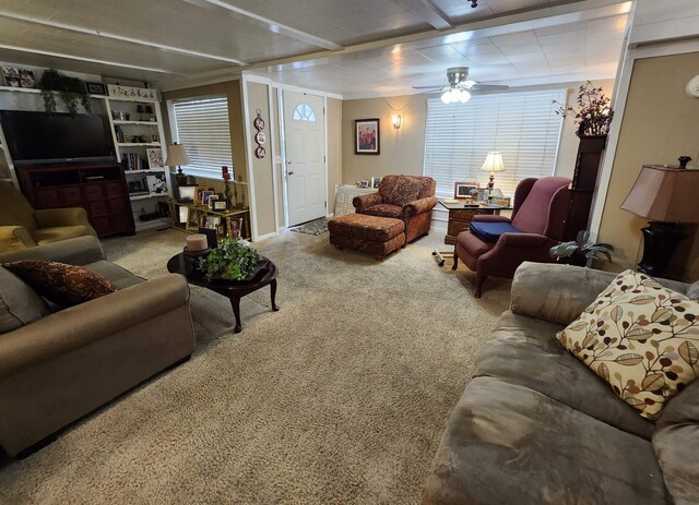  - carpeted living room featuring a ceiling fan