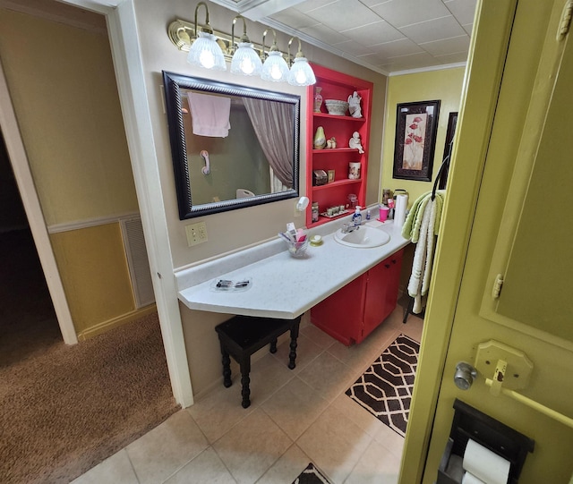  - bathroom with tile patterned floors, vanity, and ornamental molding